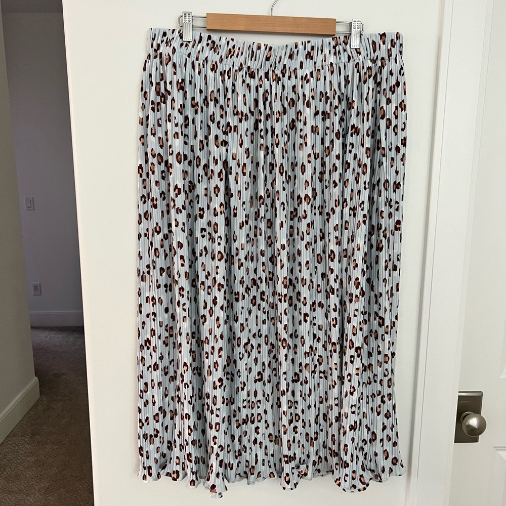 Light blue pleated mini skirt.